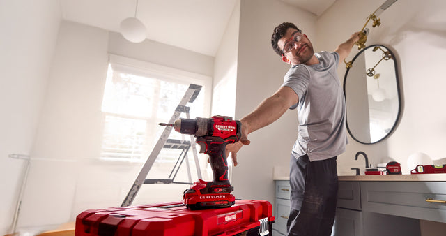 Man reaching for drill